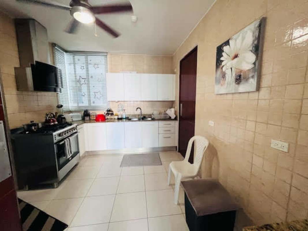 Contemporary kitchen with granite counters and appliances in PH Bella Vista Park Panama City