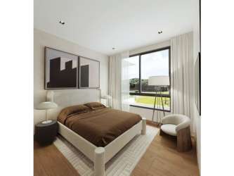 Minimalist bedroom with large window natural light and wood floor at Explora Panama Pacifico