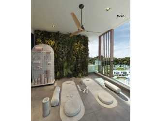 Modern indoor yoga studio with vertical garden and large windows at Explora Panama Pacifico