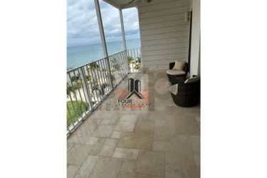 Ocean-view balcony with marina and palm trees at PH Puntarena Ocean Village Panama