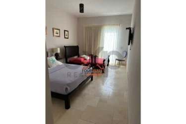 Bedroom with large window and elegant decor at Puntarena Ocean Village in Buenaventura Panama