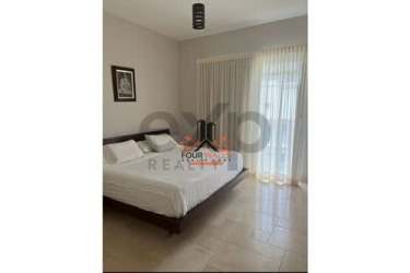 Bedroom with window views and neutral décor at PH Puntarena Ocean Village