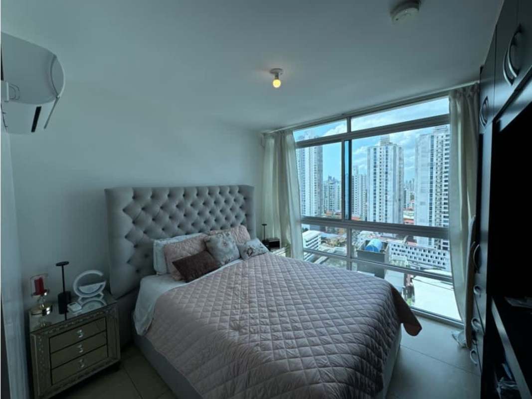 Bedroom with large windows and city views in PH Vista Park Carrasquilla Panama