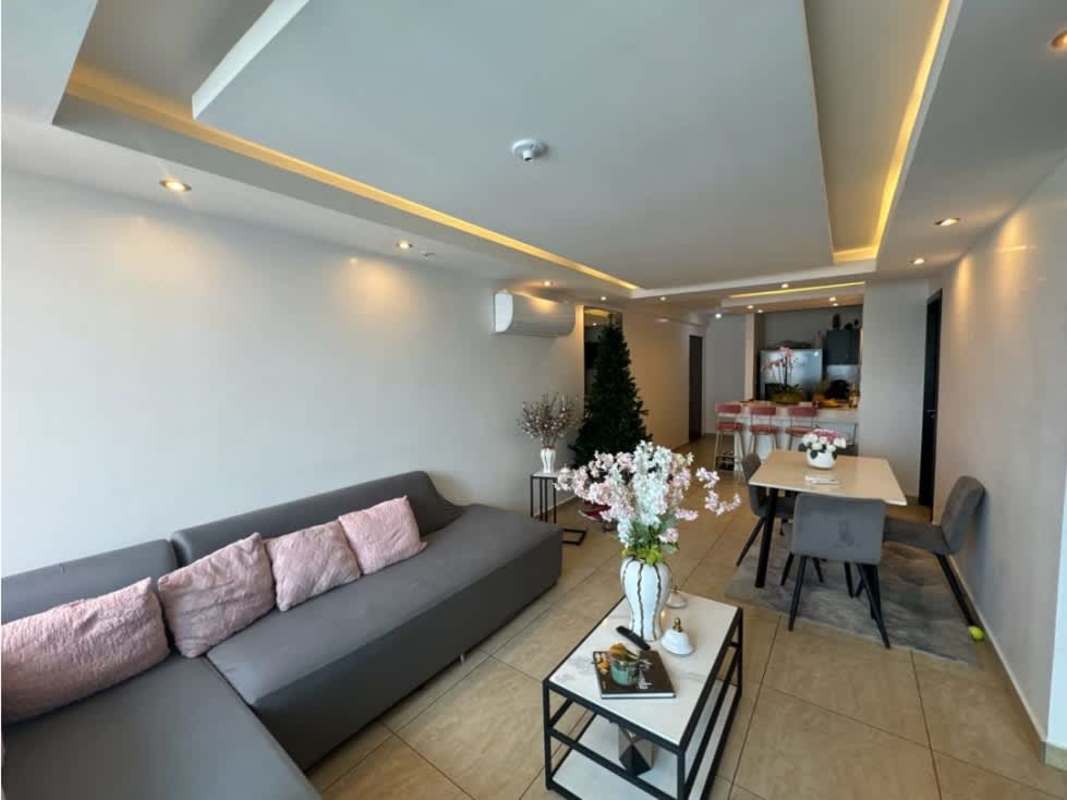 Living dining area with large sofa and windows PH Vista Park Carrasquilla Panama