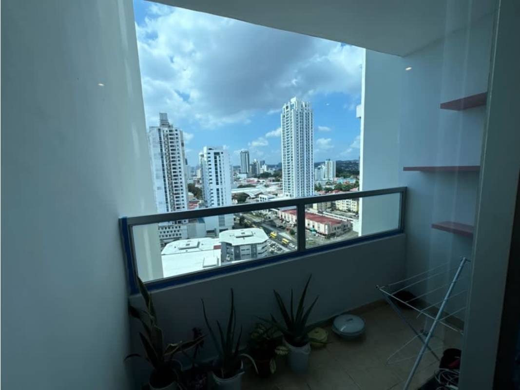 Balcony with glass railing overlooking cityscape PH Vista Park Carrasquilla Panama