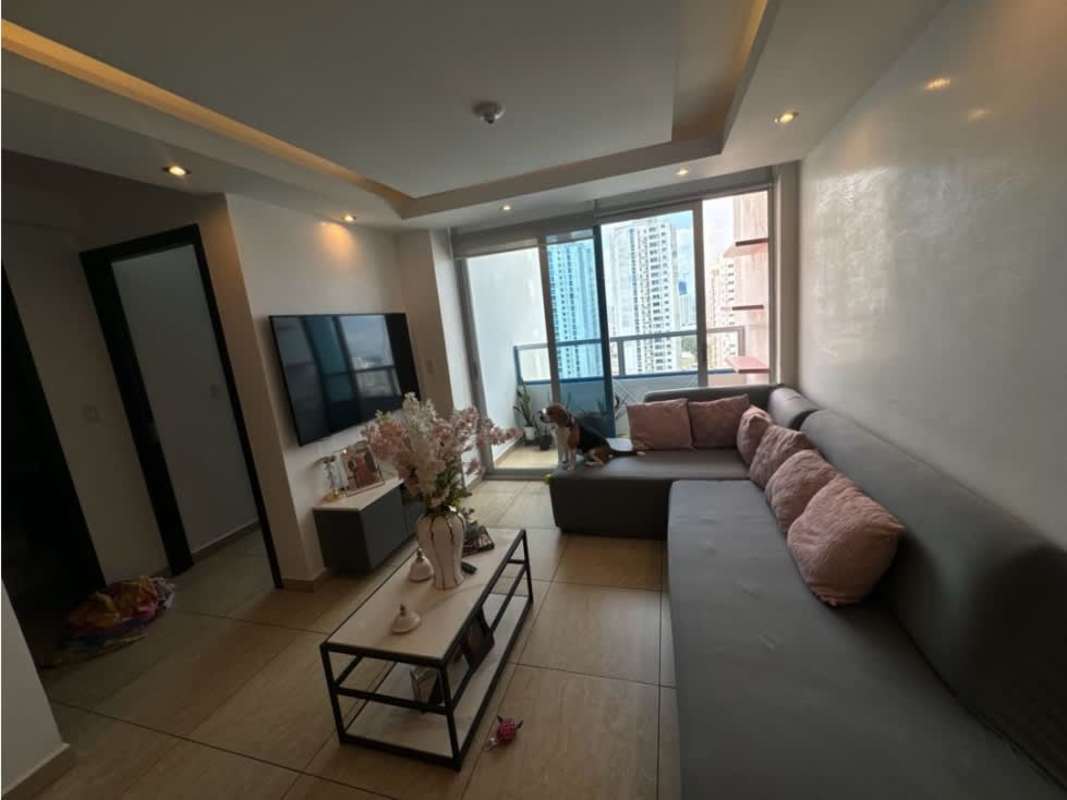 Apartment with sectional sofa, mounted TV and large window in PH Vista Park Carrasquilla Panama