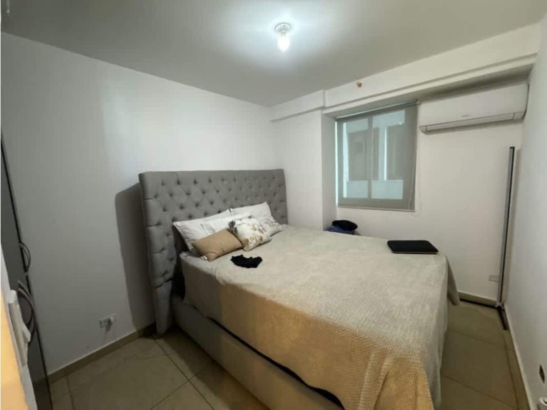 Small bedroom with tufted bed and wardrobe PH Vista Park Carrasquilla Panama