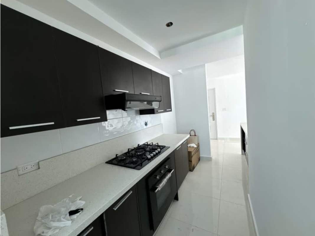 Minimalist modern kitchen with gas stove, white tile backsplash at PH Teus Tower II Carrasquilla