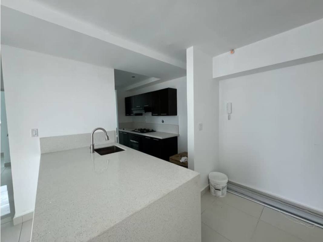 Modern kitchen with black cabinets, white countertop, stove in Panama