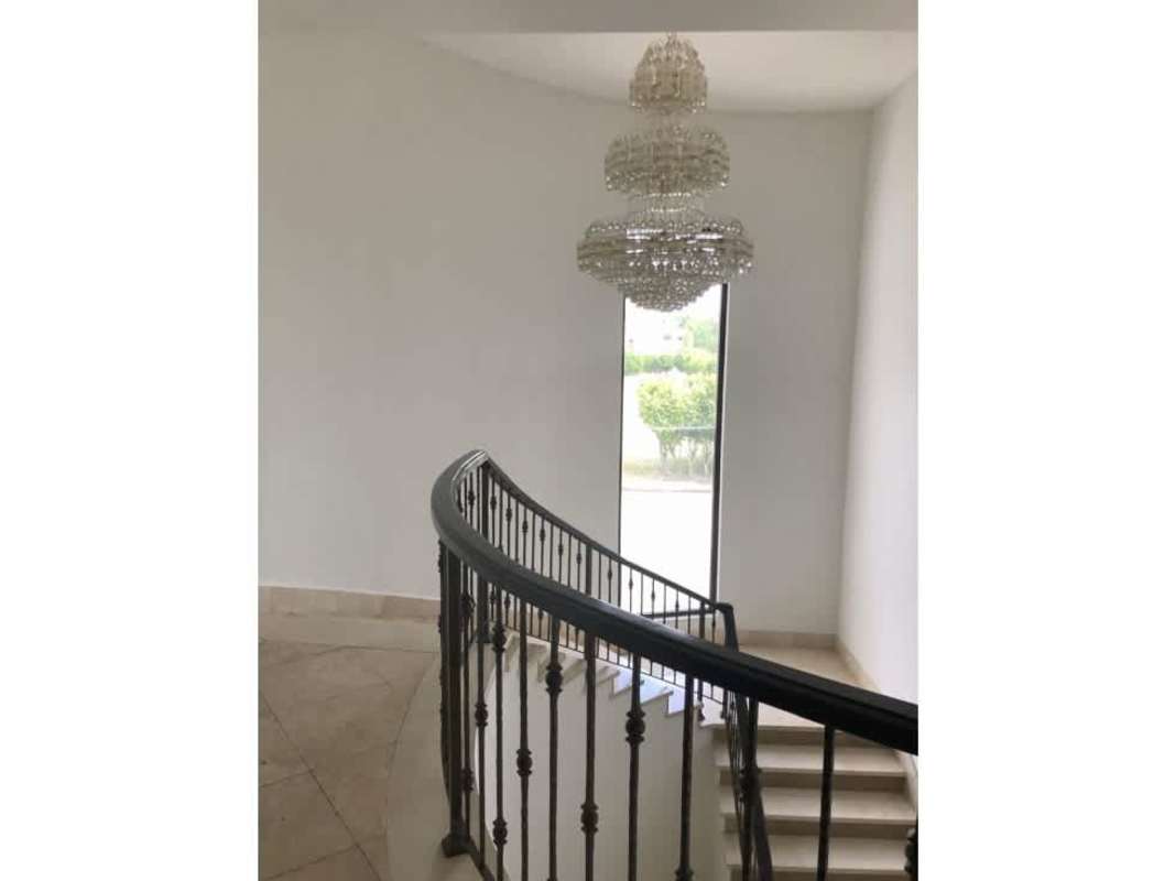 Spacious luxury living room with marble flooring, double-height ceiling chandelier in Costa del Este Panama