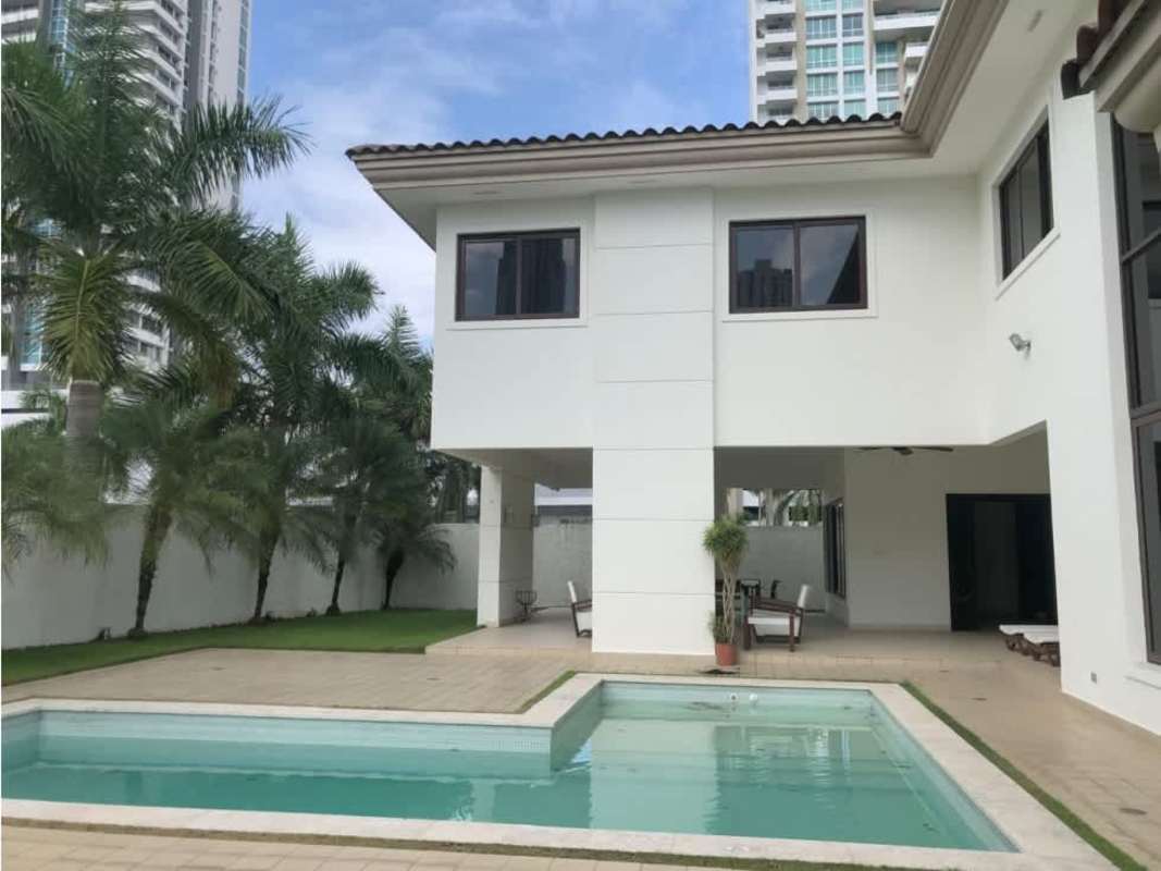 L-shaped swimming pool sun deck lush gardens luxury house Costa del Este Panama PH Paseo del Parque