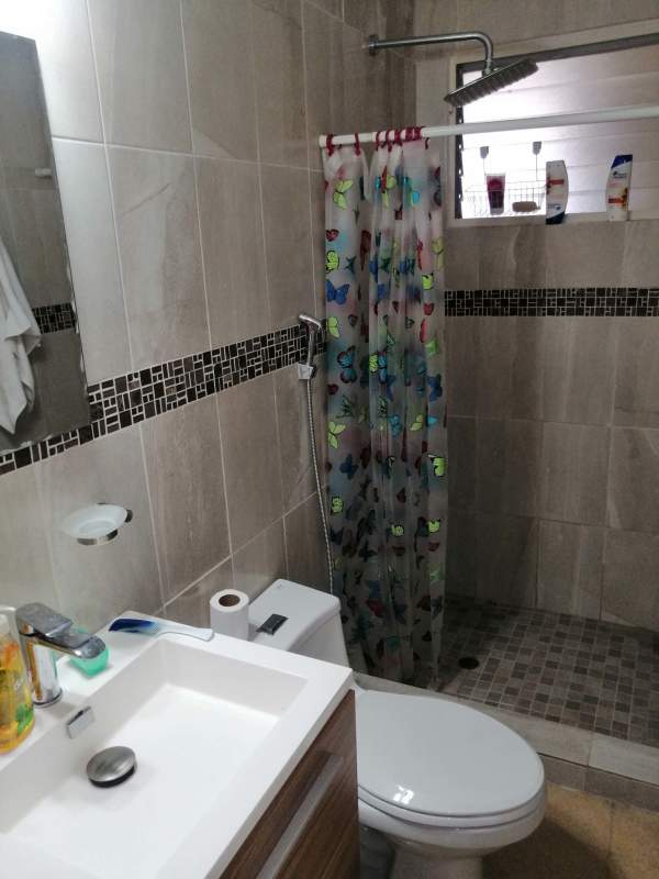 Bedroom with built-in closet, air conditioning and tiled floor in PH Altamar apartment Bella Vista Panama