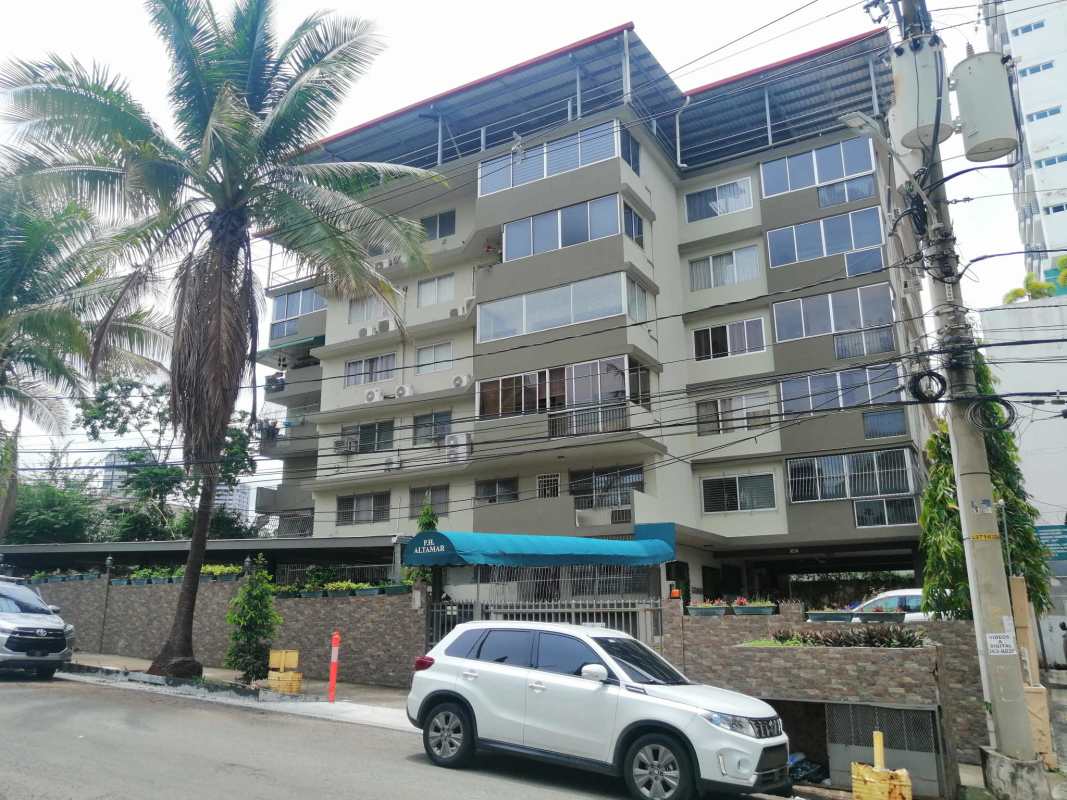 Large living dining area with tiled floor and balcony access in PH Altamar Bella Vista Panama City apartment
