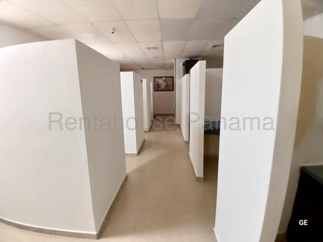 Multiple cubicle style offices with partitions tiled flooring ceiling lights PH Kamelia Plaza Panama