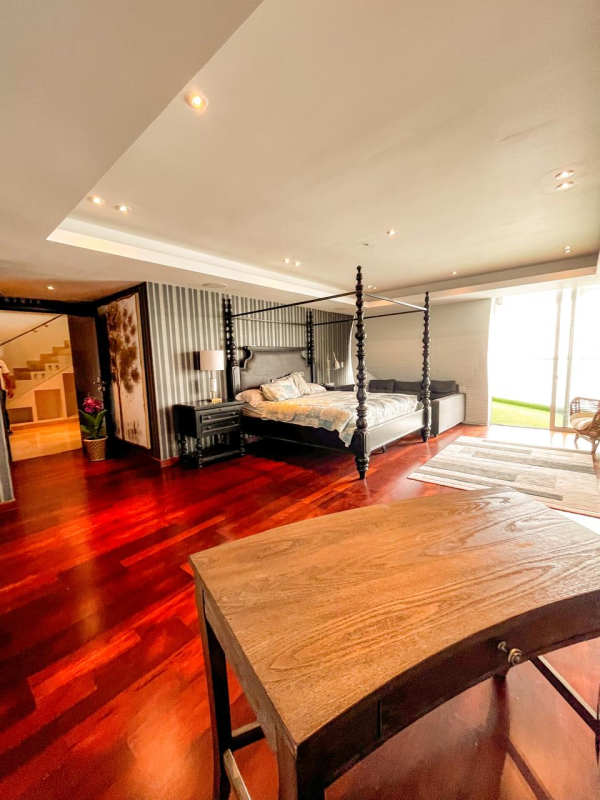 Guest bedroom with wood floors and private balcony in PH BICSA Tower Panama
