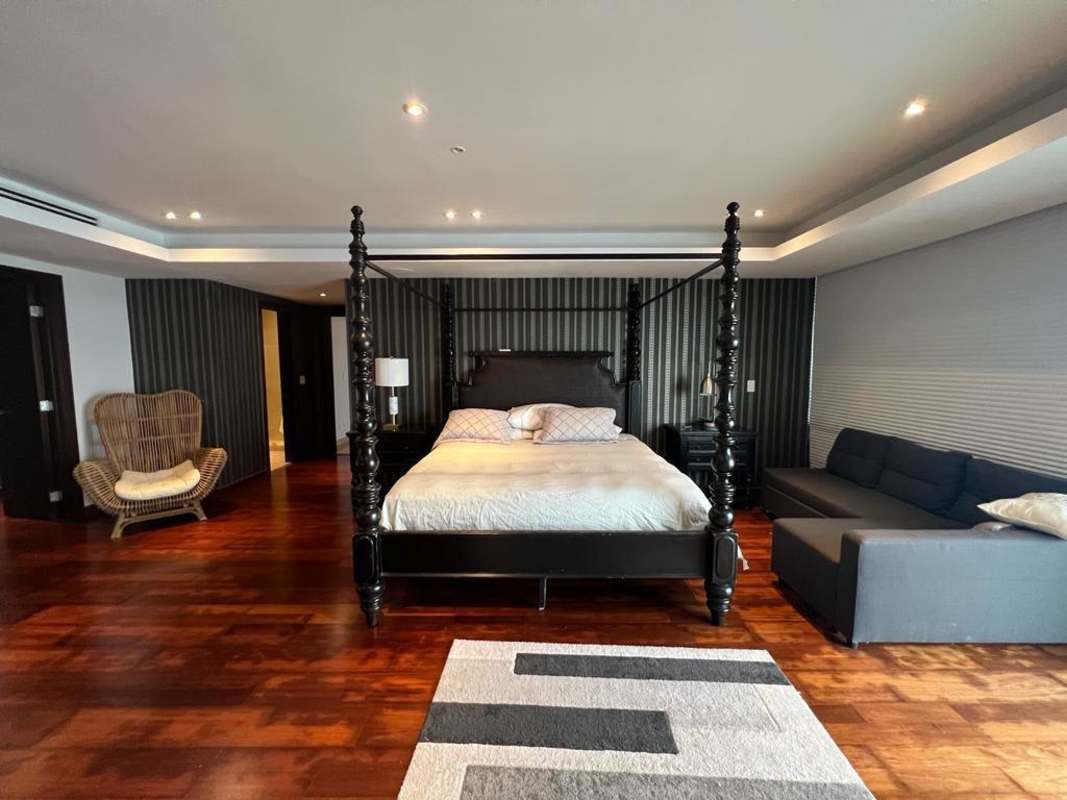 Elegant master suite with parquet floors, ocean view balcony, walk-in closet and marble bath PH BICSA Tower Panama