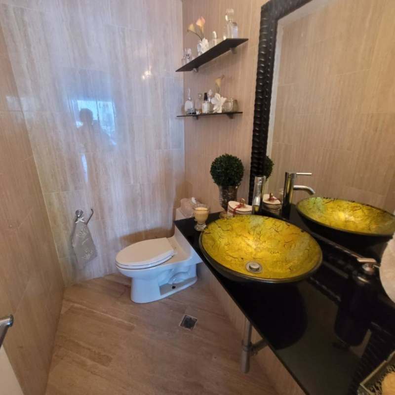 Modern bathroom with vessel glass sink and sleek design at PH Peninsula Punta Paitilla Panama