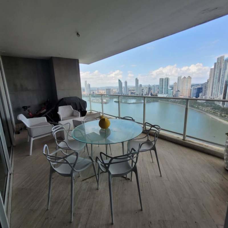 Spacious balcony with glass railings showcasing panoramic city and ocean views in PH Peninsula Punta Paitilla
