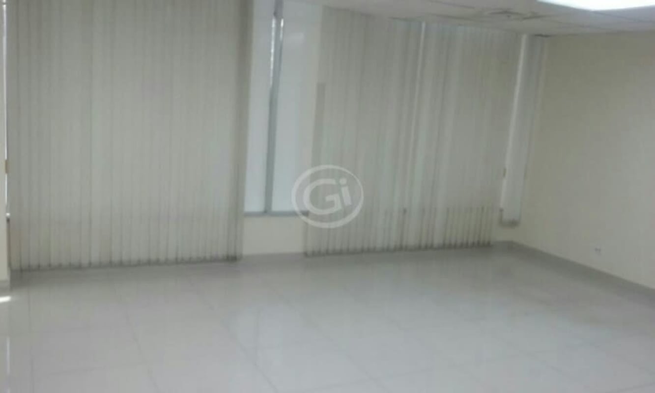 Open office space with tiled floors large windows blinds in Plaza Ejecutiva Panama
