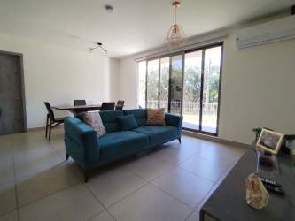 Kitchen with granite countertops white cabinets and stainless appliances PH Madeira
