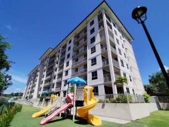 Family friendly condo playground and landscaped green PH Madeira