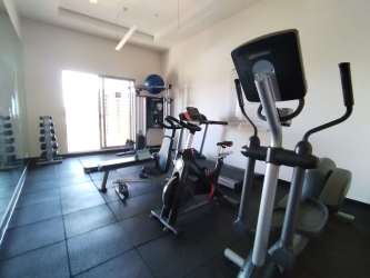 Private residents gym with cardio equipment weights mirrored wall PH Madeira Panama