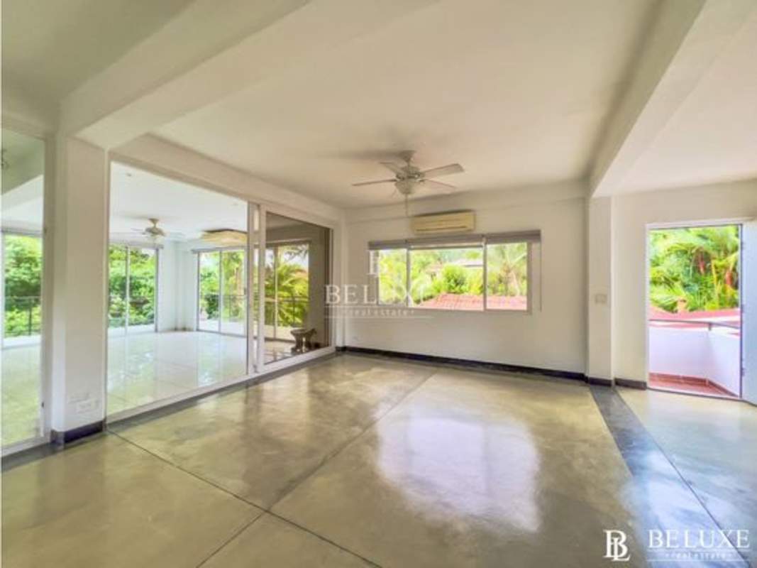 Modern renovated kitchen with granite countertops, stainless appliances, breakfast bar in duplex home Albrook Panama