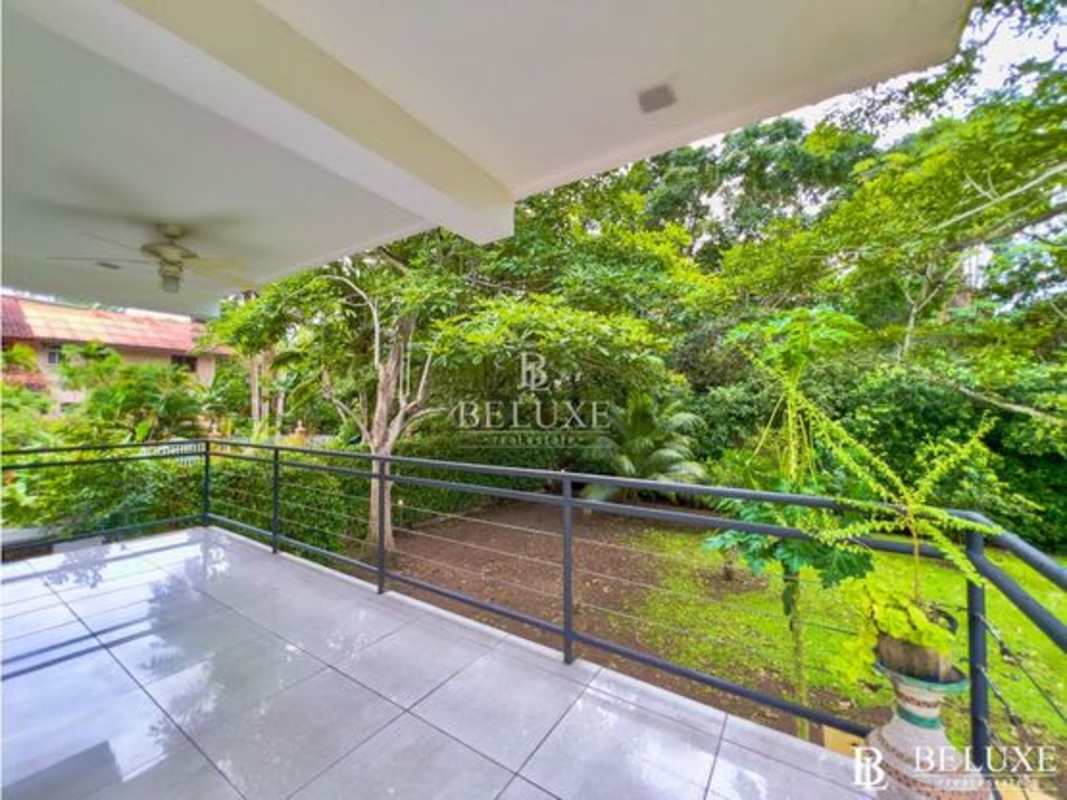 Private swimming pool surrounded by patio and covered bohío barbecue lounge in Albrook duplex rental