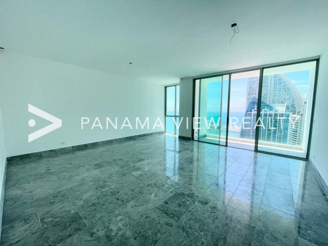 Open plan marble floor living area with panoramic ocean view windows in Pacific Point Tower 400 Panama