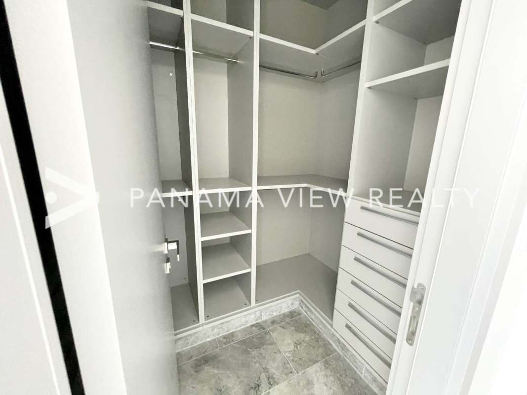 Spacious master bedroom with ocean view window marble floor in Pacific Point Tower 400