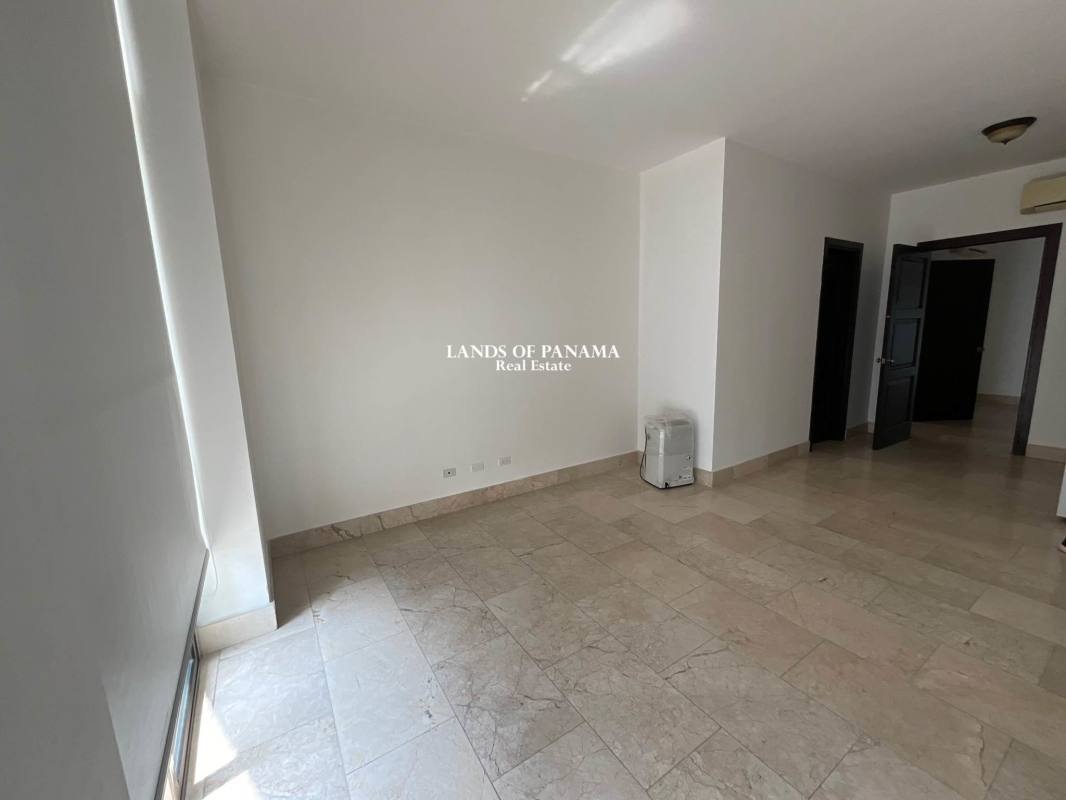 Elegant master suite with marble floors, large window, and ocean views PH Pacific Point Punta Pacifica