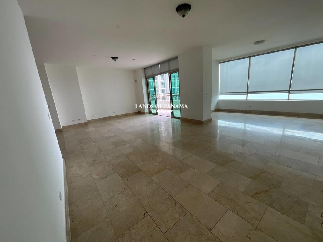 Spacious kitchen with granite countertops and modern cabinetry in Pacific Point apartment Panama