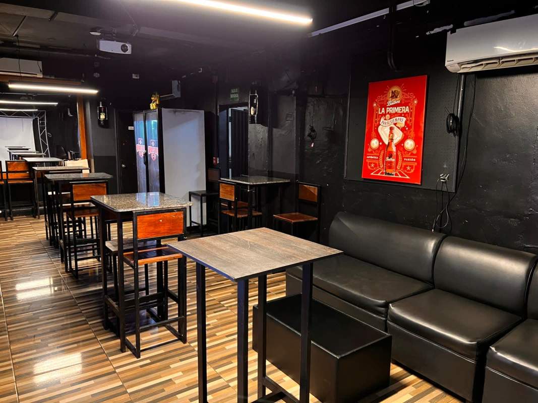 Bar lounge area black sofa high tables commercial property Obarrio Panama