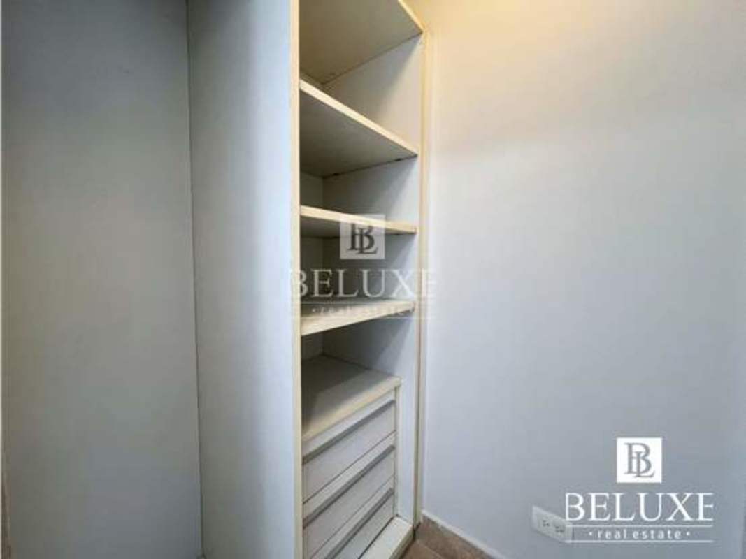 Bedroom with large window ocean view, walk-in closet and AC at PH YOO Panama rental