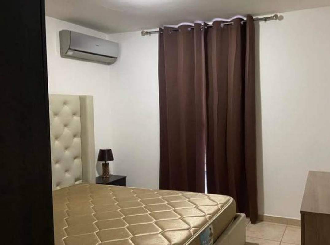 Bedroom featuring AC unit, curtains, headboard and tiled floor PH Metro Tower Panama City