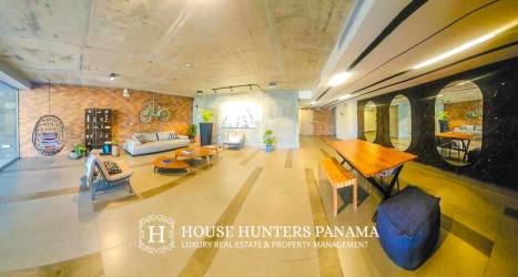 Bright bedroom with modern furniture and window views at PH Explora Panama Pacifico