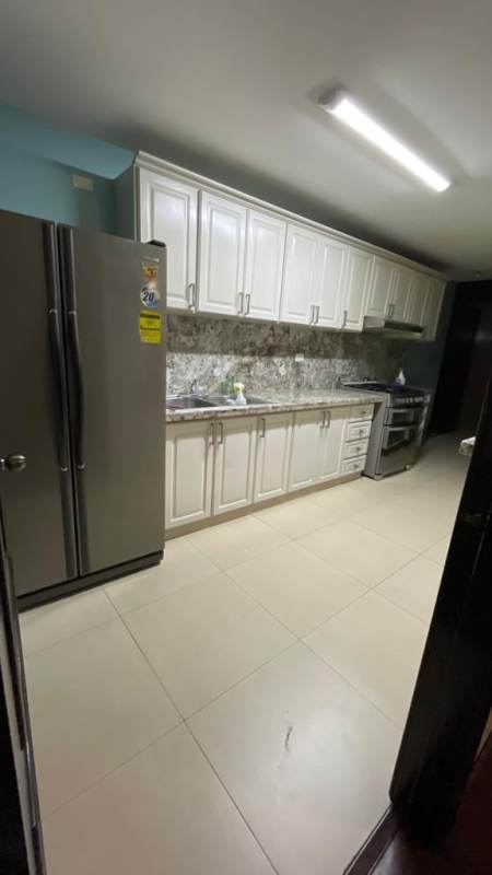 Open living and dining room with large windows wood flooring in Condado del Rey Panama