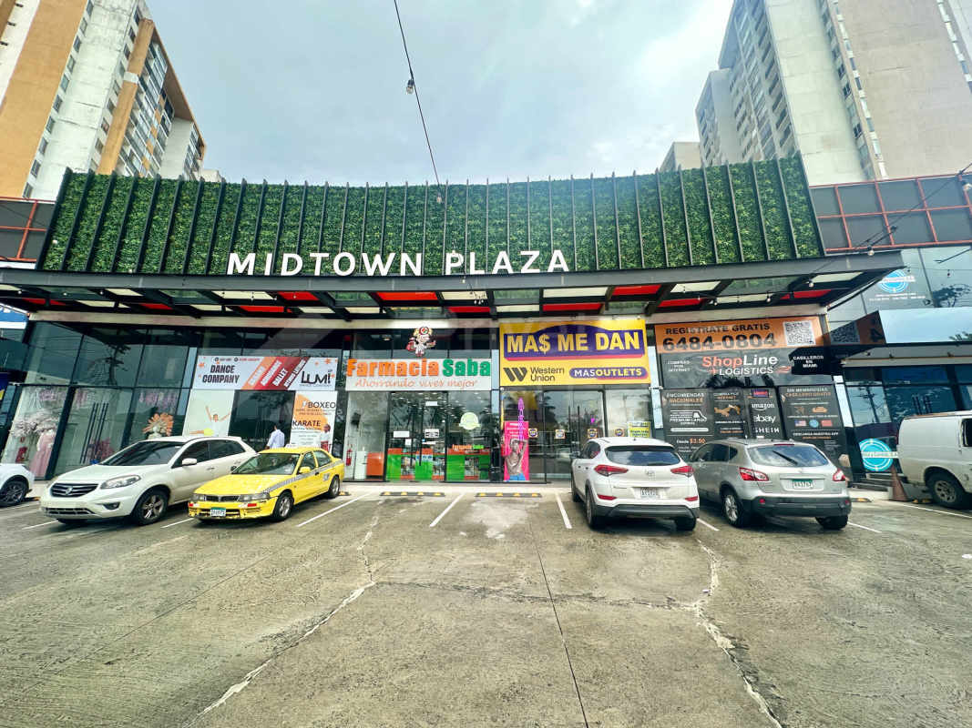 Exterior view of Midtown Plaza retail commercial center with storefronts, signage and parking on Avenida Ricardo J. Alfaro Panama City