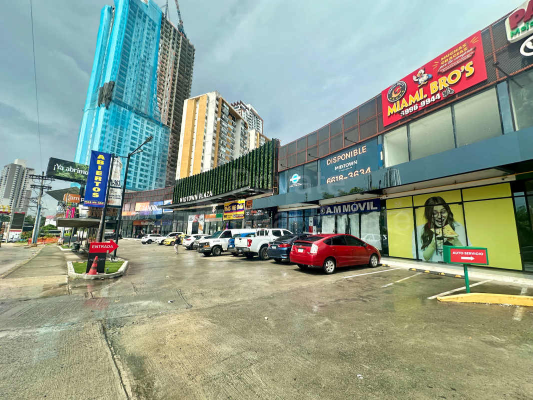 Facade with stores, parking lot, and retail units at Midtown Plaza on Tumba Muerto, Panama
