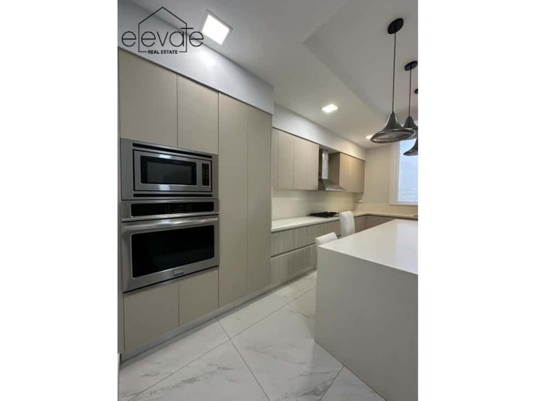 Elegant dining area with marble floors, panoramic views in Gardens Punta Pacifica Panama