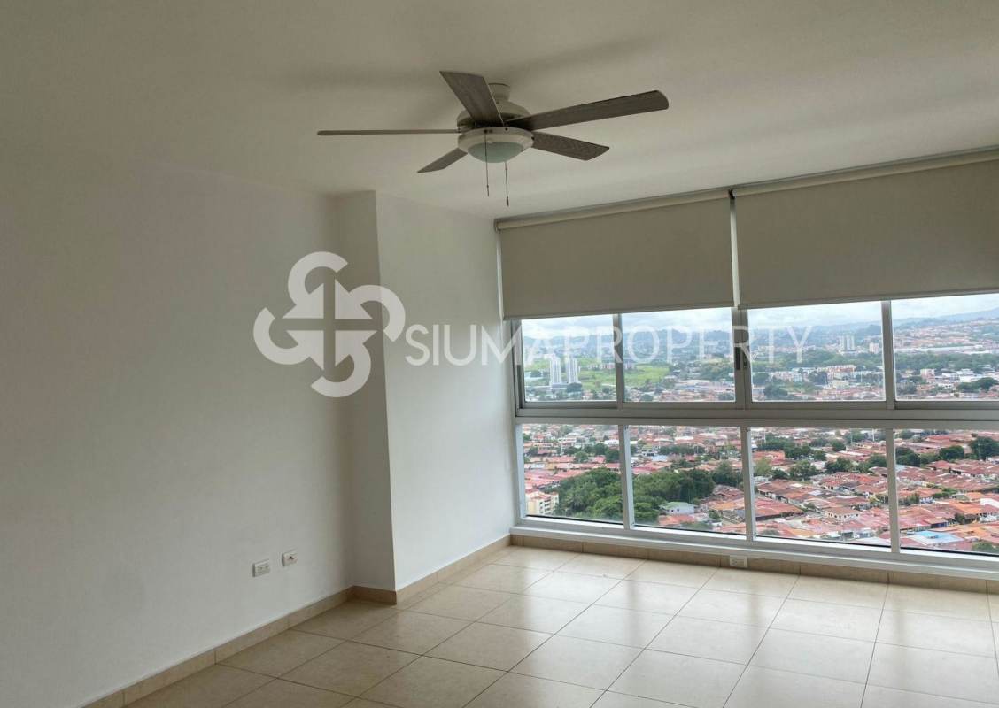 Living room with panoramic windows overlooking city skyline in PH Sol del Este Costa del Este Panama