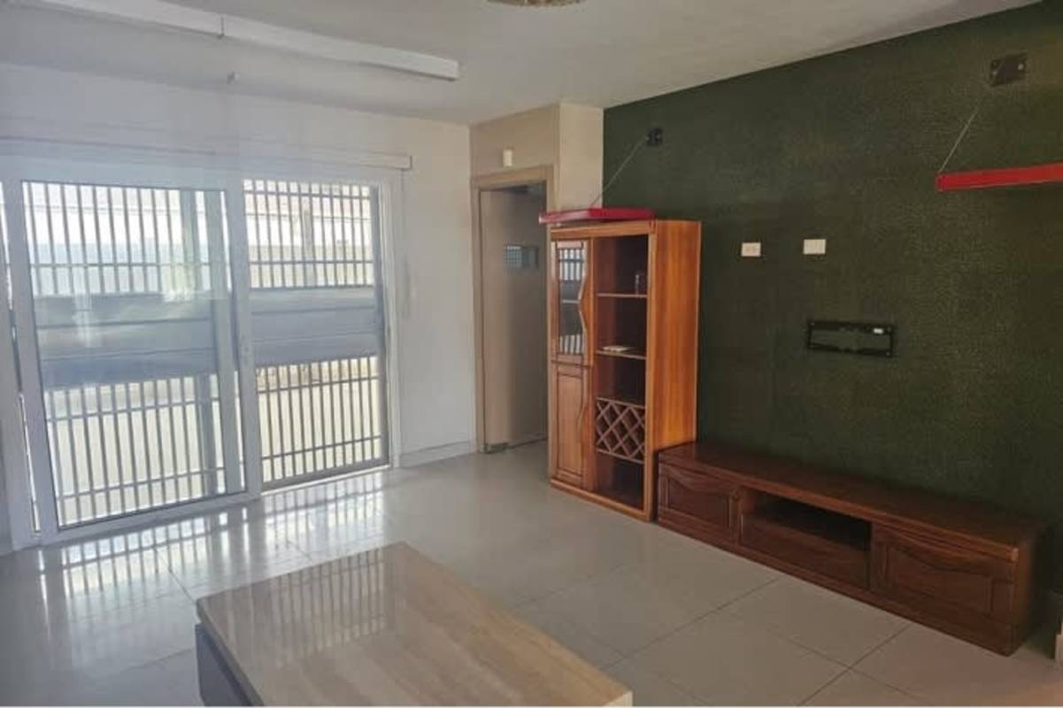 Living room with sliding doors wooden furniture accent wall home for rent in Panama