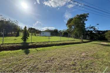 Large green flat lot with fencing at Hacienda La Florenciana Las Uvas Panama