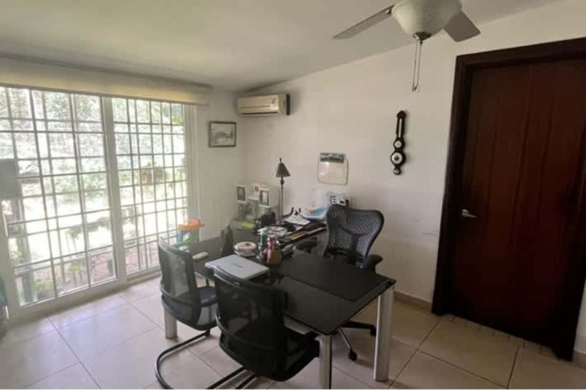 Modern minimalist bathroom with glass-enclosed shower, large mirror and vanity in house Llanos de Curundú Panama