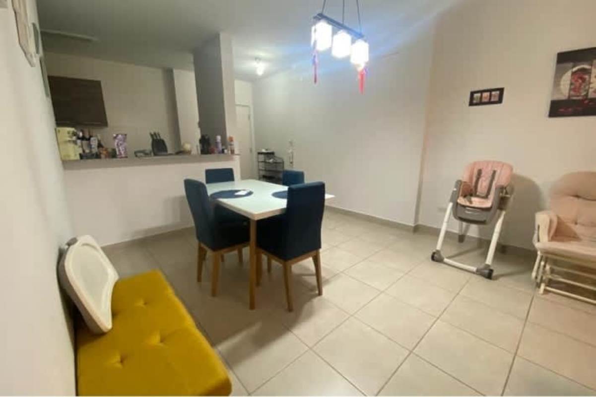 Spacious open kitchen with granite countertops and modern cabinetry in Brisas del Golf Panama