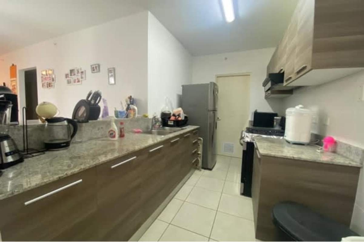 Master bedroom with large windows and ensuite bathroom apartment in Brisas del Golf Panama