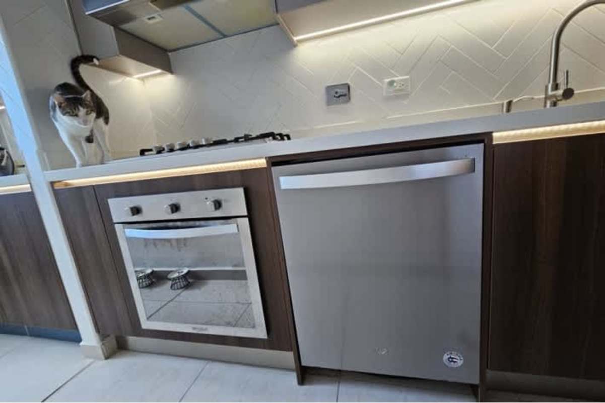 Contemporary kitchen with appliances, stone countertop, backsplash at PH Vista Park Panama City