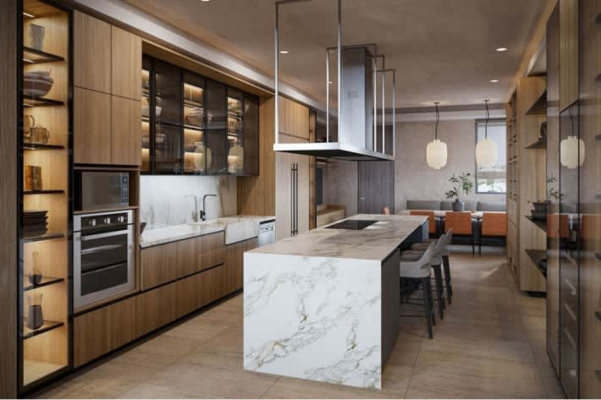 Modern kitchen with marble island and dining area in luxury oceanfront condo Costa del Este Panama