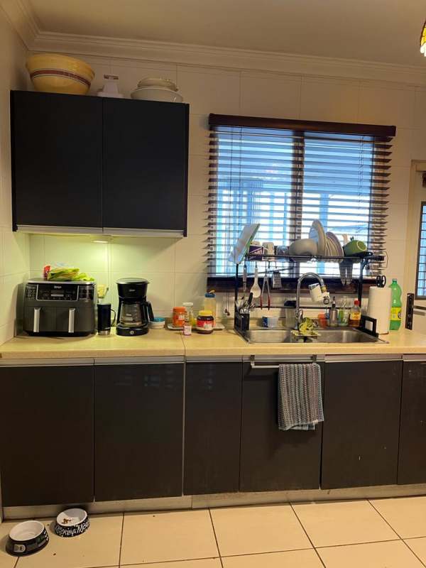 Kitchen with granite countertops and wood cabinetry PH Augusta Brisas del Golf