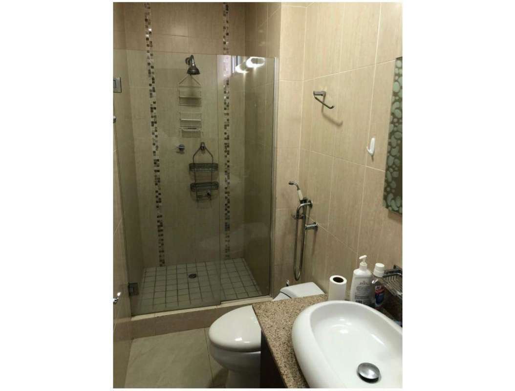 Master bedroom with city and ocean views, AC unit and large windows PH Pacific Sky Punta Paitilla Panama